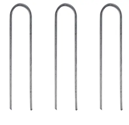 Landscape staples used to secure drip irrigation tubing to the ground.